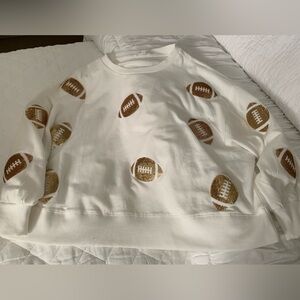 Cute white sweater shirt with sparkly footballs